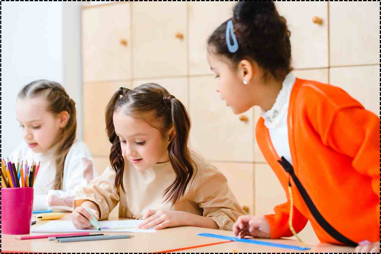 Happy kids studying together in a school environment.